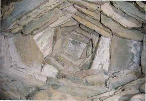Corbel Vault at Newgrange. In this photo you can see that as the vault rises it becomes narrow and it ends finally in one capstone. 