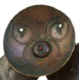 Petrie Crown detail; In this detail of the roundel it is possible to see how the curved lines end up in a birds head. It is believed that these birds heads would once each have held an enamel bead but that these beads have since fallen out. 